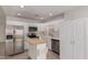 Modern kitchen with stainless steel appliances and white cabinets at 12739 W Beechwood Dr, Sun City West, AZ 85375