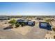 Aerial view of house with detached garage and solar panels at 30009 W Latham St, Buckeye, AZ 85396