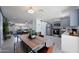 Modern kitchen with gray cabinets and a dining area at 1533 E Kramer St, Mesa, AZ 85203