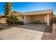 Tan house with carport and landscaped yard at 907 E 9Th Ave, Mesa, AZ 85204