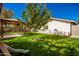 Backyard with lush lawn, gazebo, and wood fence at 907 E 9Th Ave, Mesa, AZ 85204