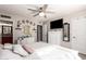 Spacious bedroom with a white dresser, a full-size bed, and a ceiling fan at 907 E 9Th Ave, Mesa, AZ 85204