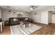 Living room with hardwood floors, sectional sofa, and coffee table at 907 E 9Th Ave, Mesa, AZ 85204
