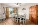 Dining room with a farmhouse table, six chairs, and a wooden cabinet at 907 E 9Th Ave, Mesa, AZ 85204