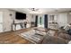Living room with comfy seating, a large TV, and wood-look floors at 907 E 9Th Ave, Mesa, AZ 85204