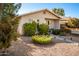 Tan house with landscaped yard and walkway at 907 E 9Th Ave, Mesa, AZ 85204