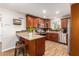 Open kitchen with island, granite countertops, and wood cabinets at 907 E 9Th Ave, Mesa, AZ 85204