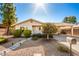 Tan house with landscaped yard, walkway, and mailbox at 907 E 9Th Ave, Mesa, AZ 85204