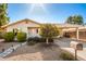 Tan house with landscaped yard, walkway, and mailbox at 907 E 9Th Ave, Mesa, AZ 85204