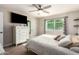 Bedroom with a bed, dresser, and window with blinds at 907 E 9Th Ave, Mesa, AZ 85204
