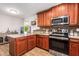 Kitchen features wood cabinets, granite countertops, and stainless steel appliances at 907 E 9Th Ave, Mesa, AZ 85204