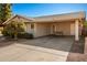 Tan house with carport and landscaped yard at 907 E 9Th Ave, Mesa, AZ 85204
