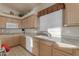 Bright kitchen with ample cabinetry, island, and stainless steel appliances at 2336 N Salem St, Mesa, AZ 85215