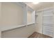 Large walk-in closet with hanging rods and shelving at 7131 E Rancho Vista Dr # 3001, Scottsdale, AZ 85251