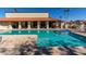 Refreshing pool and spa with surrounding lounge chairs at 542 S Higley Rd # 99, Mesa, AZ 85206