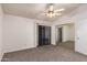 Bedroom with ceiling fan, mirrored closet, and sliding glass doors at 542 S Higley Rd # 99, Mesa, AZ 85206