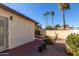 Landscaped backyard with patio and block wall at 542 S Higley Rd # 99, Mesa, AZ 85206