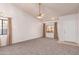 Bright living room featuring carpet, vaulted ceilings, and a ceiling fan at 542 S Higley Rd # 99, Mesa, AZ 85206