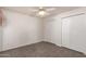 Bright bedroom with ample closet space and neutral carpeting at 542 S Higley Rd # 99, Mesa, AZ 85206