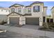 Two-story house with two-car garage and landscaped front yard at 5025 E Anderson Dr, Scottsdale, AZ 85254