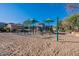 Sand playground with swings and climbing structures at 4307 E Jesse St, Gilbert, AZ 85295
