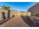 Gravel driveway with gated entry, offering privacy and ample parking at 146 S La Barge Rd, Apache Junction, AZ 85119