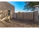 View of a tan metal gate and a portion of the property's exterior wall at 146 S La Barge Rd, Apache Junction, AZ 85119