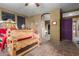 Bedroom with wooden bench and artistic wall decor at 1904 E Venado Dr, New River, AZ 85087