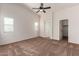 Main bedroom with carpeted floor and ceiling fan at 44043 W Cypress Ln, Maricopa, AZ 85138