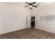 Spacious main bedroom with neutral walls and carpet at 44043 W Cypress Ln, Maricopa, AZ 85138