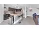 Modern kitchen with granite countertop island and stainless steel appliances at 10847 E Forge Cir, Mesa, AZ 85208