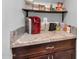 Kitchen counter with coffee maker and pantry storage at 10847 E Forge Cir, Mesa, AZ 85208