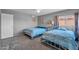 Two twin beds in a sunny bedroom with light blue bedding at 10847 E Forge Cir, Mesa, AZ 85208