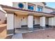 Exterior view of a charming two-story home with a front porch at 10847 E Forge Cir, Mesa, AZ 85208