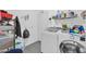 Bright laundry room with washer, dryer, and ample storage at 10847 E Forge Cir, Mesa, AZ 85208