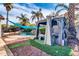 Landscaped backyard with a gazebo, pool, and lush greenery at 10847 E Forge Cir, Mesa, AZ 85208
