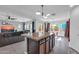 Open concept kitchen with granite island and stainless steel appliances at 10847 E Forge Cir, Mesa, AZ 85208