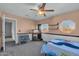 Bedroom with a single bed, dresser, and window at 10847 E Forge Cir, Mesa, AZ 85208