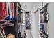 Large walk-in closet with ample hanging space and shelving at 10847 E Forge Cir, Mesa, AZ 85208