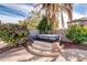 Hot tub surrounded by landscaping and stone accents at 10847 E Forge Cir, Mesa, AZ 85208