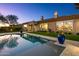 Stunning pool with reflection of home and beautiful landscaping at 8599 E Sand Flower Dr, Scottsdale, AZ 85266