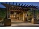 Elegant entrance with pergola and lighting at 27808 N Desierto Dr, Rio Verde, AZ 85263