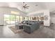 Bright and airy living room with a large sectional sofa and views of the backyard at 27808 N Desierto Dr, Rio Verde, AZ 85263