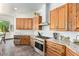 Modern kitchen with stainless steel appliances, granite countertops and custom cabinetry at 27808 N Desierto Dr, Rio Verde, AZ 85263