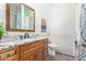 Bathroom with granite vanity, wood cabinets, and shower/tub at 27808 N Desierto Dr, Rio Verde, AZ 85263