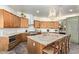 Spacious kitchen with granite island and custom cabinetry at 27808 N Desierto Dr, Rio Verde, AZ 85263
