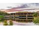 Stunning clubhouse view over a lake at sunset at 27808 N Desierto Dr, Rio Verde, AZ 85263