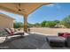 Relaxing patio with lounge chairs and view of desert landscape at 27808 N Desierto Dr, Rio Verde, AZ 85263