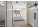 Bathroom with double vanity, bathtub, and glass shower at 6321 S Teresa Dr, Chandler, AZ 85249