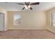 Bright bedroom with ceiling fan and carpet at 6321 S Teresa Dr, Chandler, AZ 85249